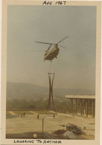 The Symbol of Progress being air lifted in