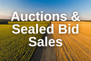 Aerial view of divided farmland promoting auctions and sealed bid sales for agricultural real estate