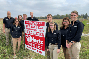 Hertz Real Estate Services team at land auction site for 151-acre farmland sale in Iowa