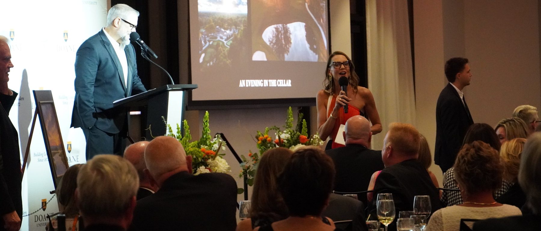 Benefit auctioneer Courtney Buman calling bids at a fundraising gala
