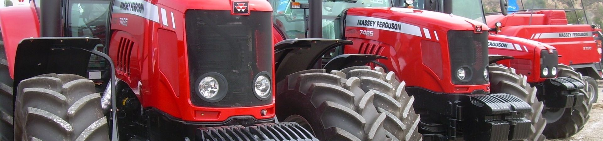 A line of red massey ferguson tractors