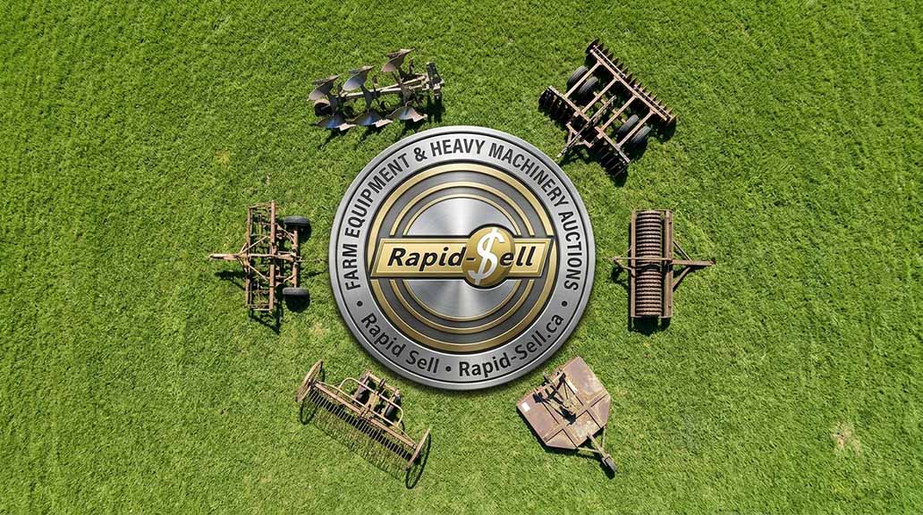 Aerial view of farm implements including plows disc harrows and mowers for sale at an Ontario auction